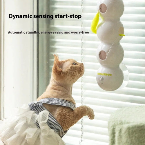 Cat looking up at a smart cat toy with text about dynamic sensing start-stop, automatic standby, energy saving, and worry-free.